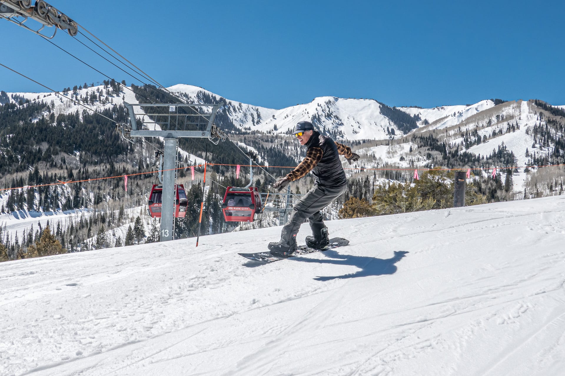 Snowboarding at Canyons Village Red Pine Gondola with Square Top in the background