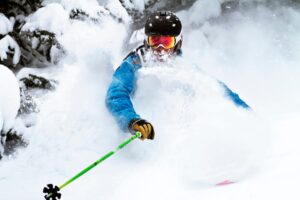 man skiing powder